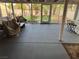 Enclosed patio featuring concrete floors, screen windows and door, neutral colors, and outdoor decor at 3316 Cutty Sark St, Las Vegas, NV 89117