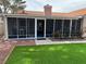 Enclosed sunroom with tile roof, artificial grass, and view to the backyard at 3316 Cutty Sark St, Las Vegas, NV 89117