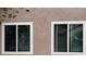 Exterior view showcasing newly installed white-framed windows on a stucco wall, enhancing energy efficiency at 3316 Cutty Sark St, Las Vegas, NV 89117