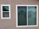 Exterior view showcasing newly installed white-framed windows on a stucco wall, enhancing natural light at 3316 Cutty Sark St, Las Vegas, NV 89117