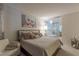 Bedroom with a queen bed, stylish artwork, and a modern bathroom featuring a soaking tub and glass-enclosed shower at 3722 Las Vegas Blvd # 2904, Las Vegas, NV 89158