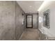 Contemporary hallway showcases tiled floors, modern lighting, and sleek mirrors for a clean and stylish aesthetic at 3722 Las Vegas Blvd # 2904, Las Vegas, NV 89158