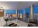 Modern living room with floor-to-ceiling windows showcasing panoramic views of the Las Vegas Strip at 3722 Las Vegas Blvd # 2904, Las Vegas, NV 89158