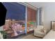 Bedroom featuring city views and a cozy seating area at 3722 Las Vegas Blvd # 2904, Las Vegas, NV 89158