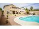 Gorgeous outdoor living area features a refreshing pool, patio space, and well-manicured landscaping at 3916 Broad Meadow Ct, Las Vegas, NV 89129