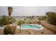 Private backyard with a custom-shaped pool, desert landscaping, and privacy walls, ideal for relaxation at 3916 Broad Meadow Ct, Las Vegas, NV 89129