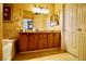 Well-lit bathroom features a dual vanity, bathtub, and tile flooring at 3916 Broad Meadow Ct, Las Vegas, NV 89129
