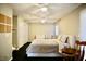Bedroom featuring large bed, ceiling fan, storage and attached sitting area at 3916 Broad Meadow Ct, Las Vegas, NV 89129