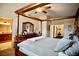 Bright bedroom features a four-poster bed, ceiling fan, and plush carpeting at 3916 Broad Meadow Ct, Las Vegas, NV 89129