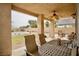 Inviting covered patio with outdoor furniture and backyard view, great for entertaining or unwinding at 3916 Broad Meadow Ct, Las Vegas, NV 89129