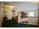 Hallway between bedrooms and office with railing and decor at 3916 Broad Meadow Ct, Las Vegas, NV 89129