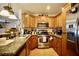 Well-equipped kitchen includes stainless steel appliances, wooden cabinets, and ample counter space at 3916 Broad Meadow Ct, Las Vegas, NV 89129