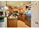Cozy kitchen with stainless steel refrigerator, wooden cabinets, and granite countertops at 3916 Broad Meadow Ct, Las Vegas, NV 89129