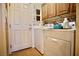 Laundry room with washer, dryer, and overhead cabinets for storage at 3916 Broad Meadow Ct, Las Vegas, NV 89129