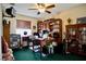 Office view with bookshelves, a desk, and personal decor with a ceiling fan at 3916 Broad Meadow Ct, Las Vegas, NV 89129