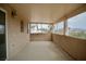 Covered patio with views of palm trees and neighboring houses offering privacy and outdoor relaxation at 3916 Broad Meadow Ct, Las Vegas, NV 89129