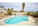 Beautiful pool with ample seating and mature landscaping, perfect for relaxing and entertaining outdoors at 3916 Broad Meadow Ct, Las Vegas, NV 89129