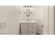 Small, well-lit bathroom with custom vanity and traditional fixtures at 4195 Balmoral Castle Ct, Las Vegas, NV 89141