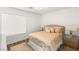 Bright bedroom featuring a queen bed with decorative pillows and matching nightstands with mirrored accents at 4195 Balmoral Castle Ct, Las Vegas, NV 89141
