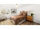 Cozy bedroom with a comfortable bed, bedside table, and a window at 4195 Balmoral Castle Ct, Las Vegas, NV 89141