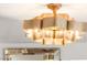 Elegant gold chandelier adds a touch of glamour to the room's decor at 4195 Balmoral Castle Ct, Las Vegas, NV 89141
