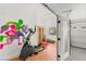 Bright home gym featuring an elliptical machine, sauna, and motivational artwork on the wall at 4195 Balmoral Castle Ct, Las Vegas, NV 89141