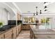 Stylish kitchen featuring granite counters, stainless steel appliances, and a view of the pool at 4195 Balmoral Castle Ct, Las Vegas, NV 89141
