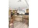 Well-appointed kitchen with a center island, stylish lighting, and modern finishes at 4195 Balmoral Castle Ct, Las Vegas, NV 89141