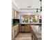 Kitchen with granite countertops, modern appliances, and backyard view at 4195 Balmoral Castle Ct, Las Vegas, NV 89141