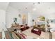 Bright, open living room with vaulted ceilings, stylish decor, and elegant furnishings at 4195 Balmoral Castle Ct, Las Vegas, NV 89141