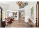 Open-concept living room featuring a high ceiling, elegant chandelier, and modern decor at 4195 Balmoral Castle Ct, Las Vegas, NV 89141