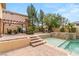 Backyard with in-ground pool and spa, plus a pergola-covered dining area with mountain views at 4195 Balmoral Castle Ct, Las Vegas, NV 89141
