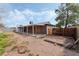 The backyard features a covered patio and storage shed at 420 Altamira Rd, Las Vegas, NV 89145