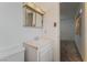 Small bathroom with toilet and sink near a bedroom entrance at 420 Altamira Rd, Las Vegas, NV 89145