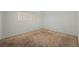 This simple bedroom features neutral walls and carpet at 420 Altamira Rd, Las Vegas, NV 89145