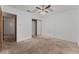 Bright bedroom featuring a ceiling fan, closet and carpeted floors at 420 Altamira Rd, Las Vegas, NV 89145