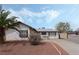 Lovely single-story home featuring desert landscaping and neutral color palette at 420 Altamira Rd, Las Vegas, NV 89145