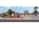 Charming single-story home featuring desert landscaping, a long driveway, and palm trees at 420 Altamira Rd, Las Vegas, NV 89145