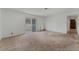 Large living room with sliding glass doors and neutral carpet at 420 Altamira Rd, Las Vegas, NV 89145