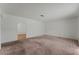 Bright and airy living room features neutral carpet and white walls at 420 Altamira Rd, Las Vegas, NV 89145