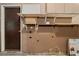 Utility room with an unfinished wall, open shelving, and work space at 420 Altamira Rd, Las Vegas, NV 89145