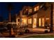 Charming backyard patio with a built-in grill and a balcony overlooking a lush garden area at 442 Beardsley Cir, Henderson, NV 89052