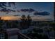 Beautiful sunset view from a balcony with lush landscaping, offering serene outdoor living at 442 Beardsley Cir, Henderson, NV 89052