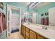 Bright bathroom with a double sink vanity and walk-in shower and bath at 442 Beardsley Cir, Henderson, NV 89052