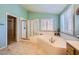 Bathroom with a large soaking tub, shower, and tiled flooring at 442 Beardsley Cir, Henderson, NV 89052
