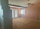 View of a spacious bedroom with a ceiling fan and neutral carpet at 442 Beardsley Cir, Henderson, NV 89052
