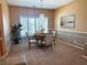 Elegant dining room featuring a chandelier and large windows with shutters at 442 Beardsley Cir, Henderson, NV 89052
