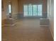 Spacious dining room with neutral tones, large window and wainscotting at 442 Beardsley Cir, Henderson, NV 89052