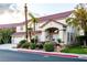 Inviting two-story home with a three-car garage, desert landscaping, and a red tile roof at 442 Beardsley Cir, Henderson, NV 89052