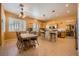 Eat-in kitchen with wood table and bar seating offering a blend of style and functionality for everyday dining at 442 Beardsley Cir, Henderson, NV 89052